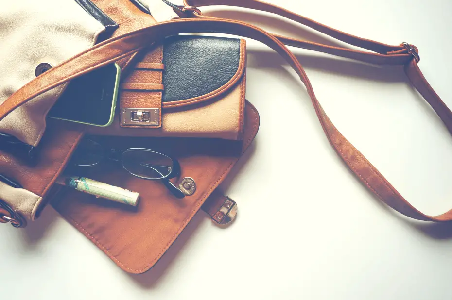 Purse lying down with contents spilling out